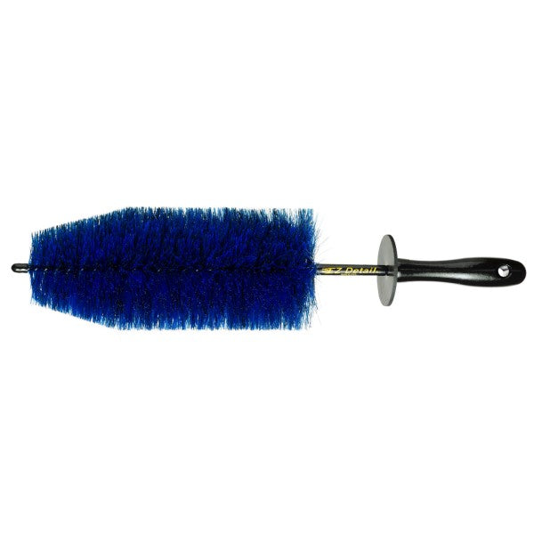 Blue brush with black handle on a white background