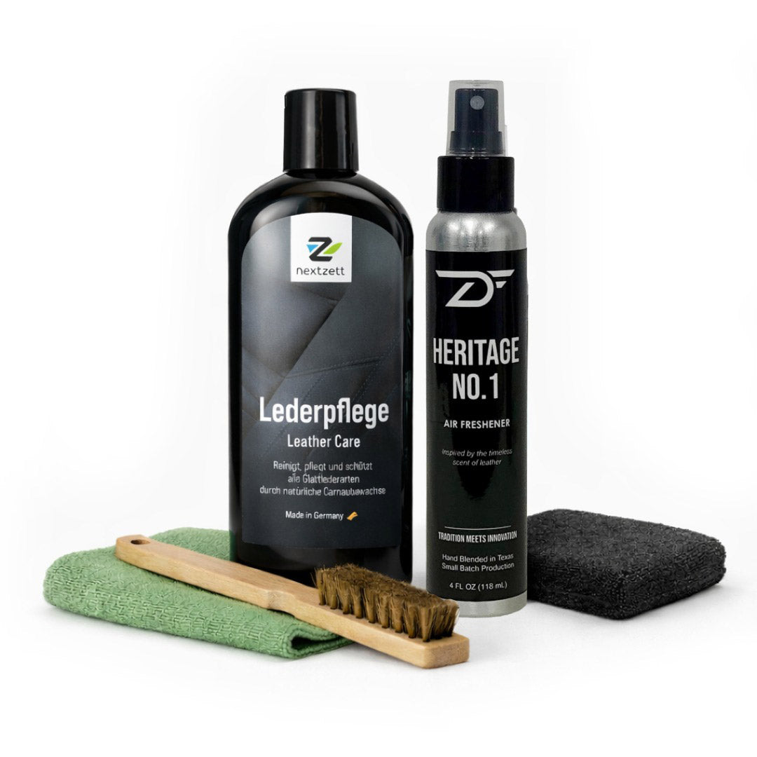 A bottle of leather care product and a bottle of leather fragrance car air freshener and cleaning tools on a white background