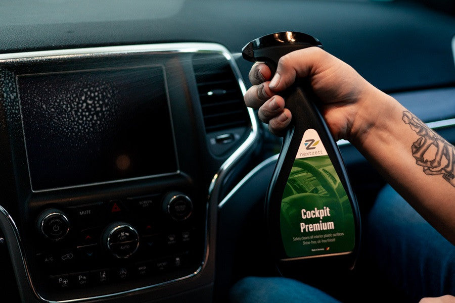 nextzett Cockpit Premium being sprayed on to a car navigation screen