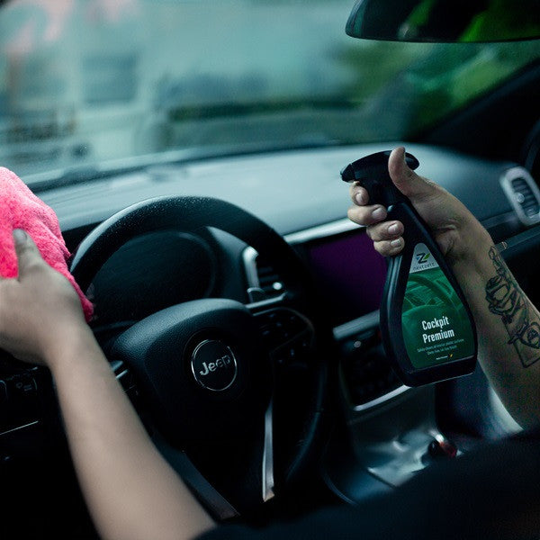 nextzett Cockpit Premium being sprayed on to a car steering wheel