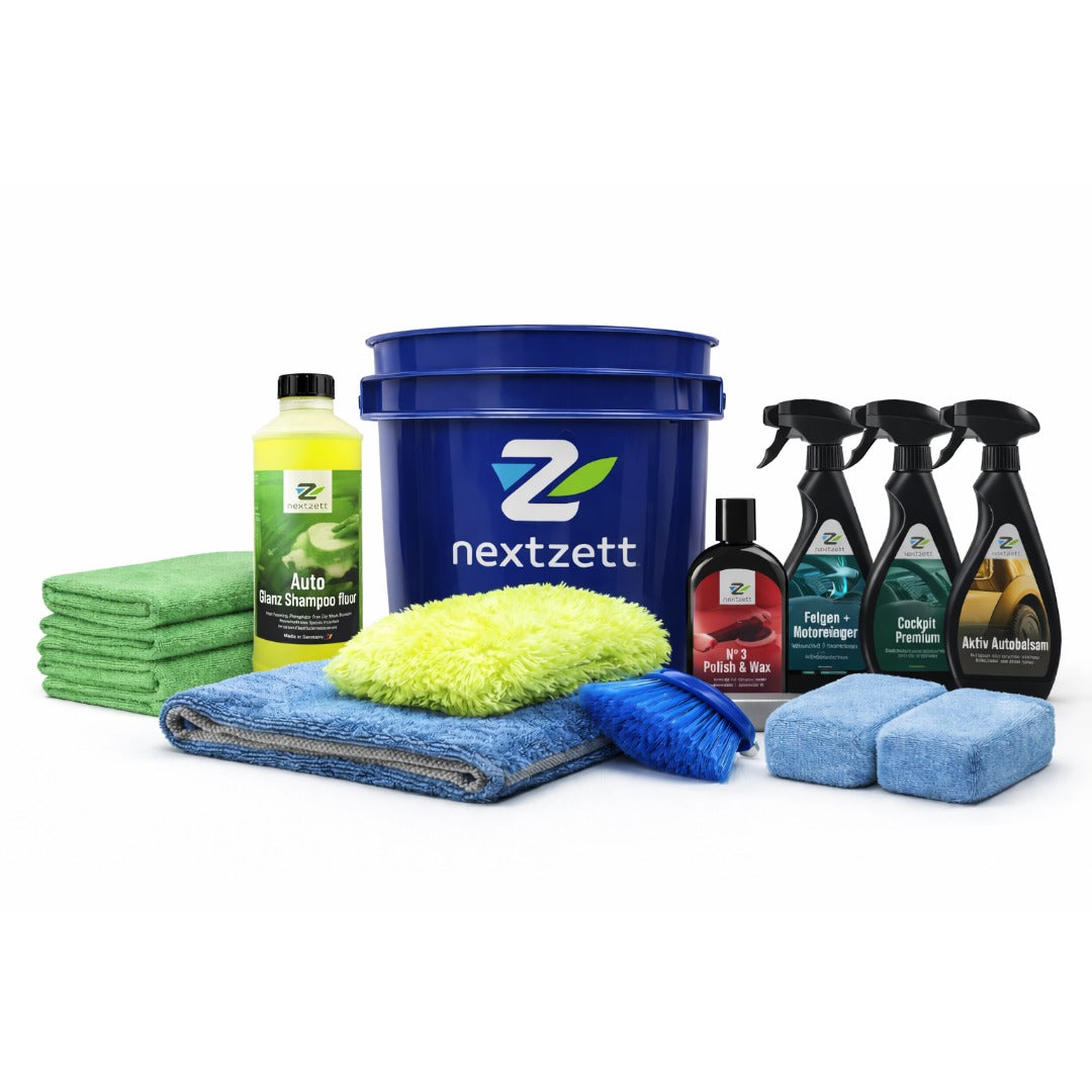 Nextzett car care products including a bucket, cloths, and cleaning solutions on a white background
