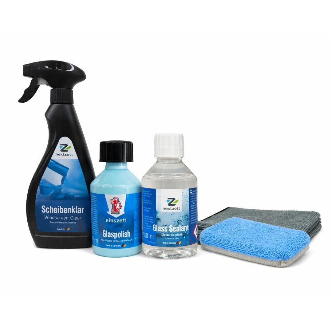 Collection of car care products including bottles and a cloth on a white background