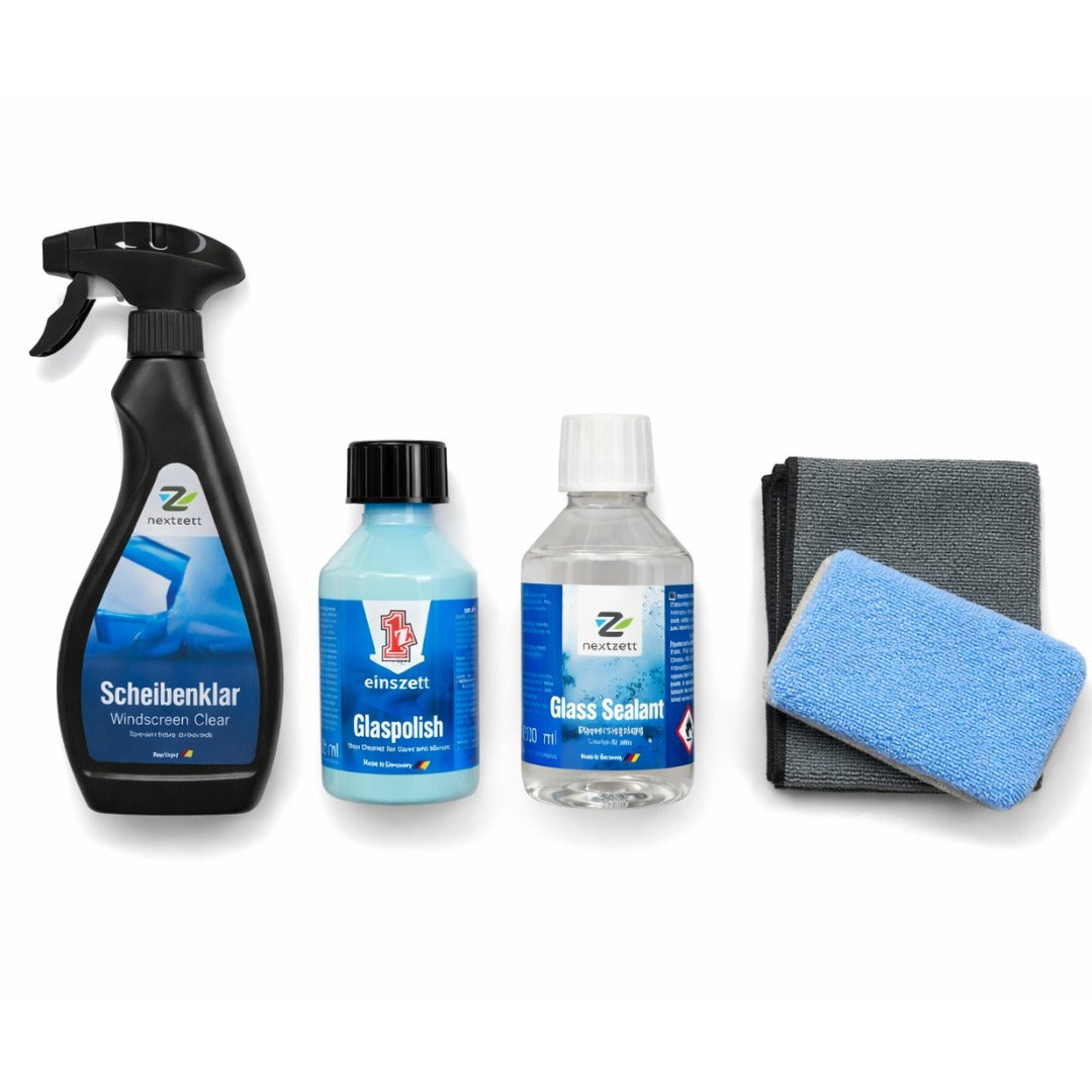 Set of car care products including sprays, bottles, a cloth, and a sponge on a white background.